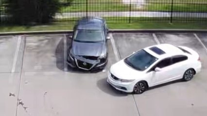 Car Crashes Into New Car While Parking
