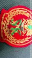 Gold embroidered badge made on the red blazer, HAND EMBROIDERY BADGES