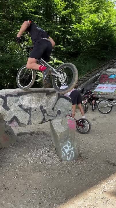 Man Tries to Ride His Bike Over Rock but Loses Balance and Falls Hard