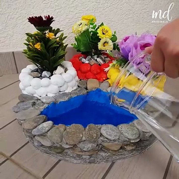 These DIY cement vases will make your front yard flowers look more gorgeous than they already are!