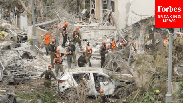 Israeli Emergency Personnel Respond To Destruction Caused By Iranian Airstrikes In Rishon Lezion