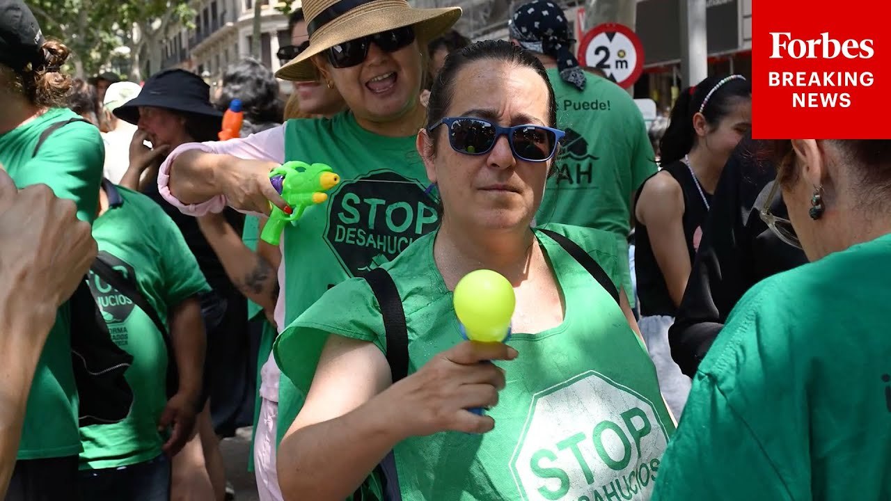 Citizens In Barcelona, Spain, Protest Tourism And Housing Costs—Some Carrying Water Pistols