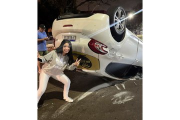 An influencer posed for pictures after her car flipped in a collision