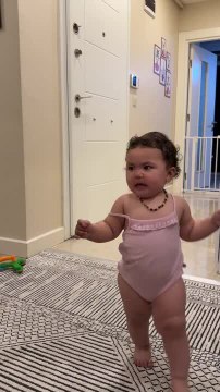 Toddler Giggles as Man Playfully Steps Over