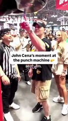 John Cena shows off his punching strength.