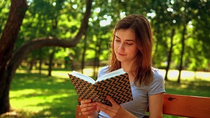 mixkit-girl-reading-a-book-in-nature-4897-hd-ready
