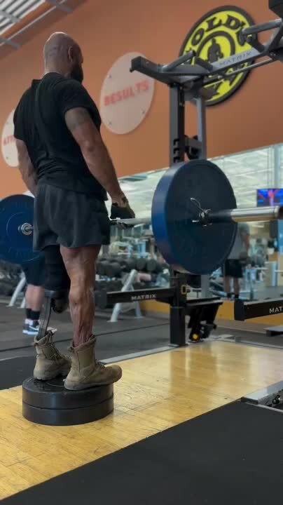 Man With Artificial Leg Does Deadlift and Pullups at Gym