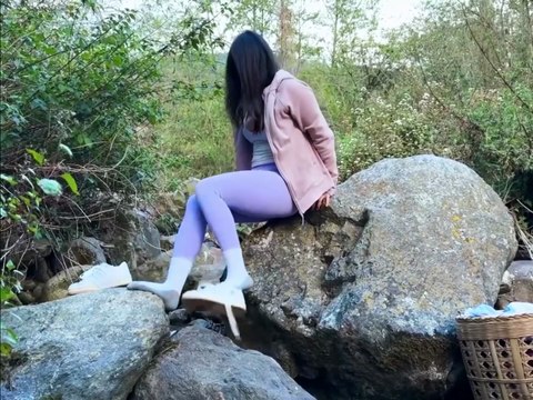 Solo girl camping alone and cooking in the woods