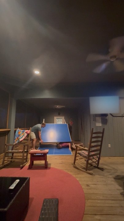 Man Leans on Ping Pong Table to Take Shot, and It Breaks in Middle