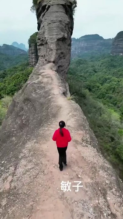 Fearless Girl Conquers Steep Cliff — But How Will She Survive the Way Down_