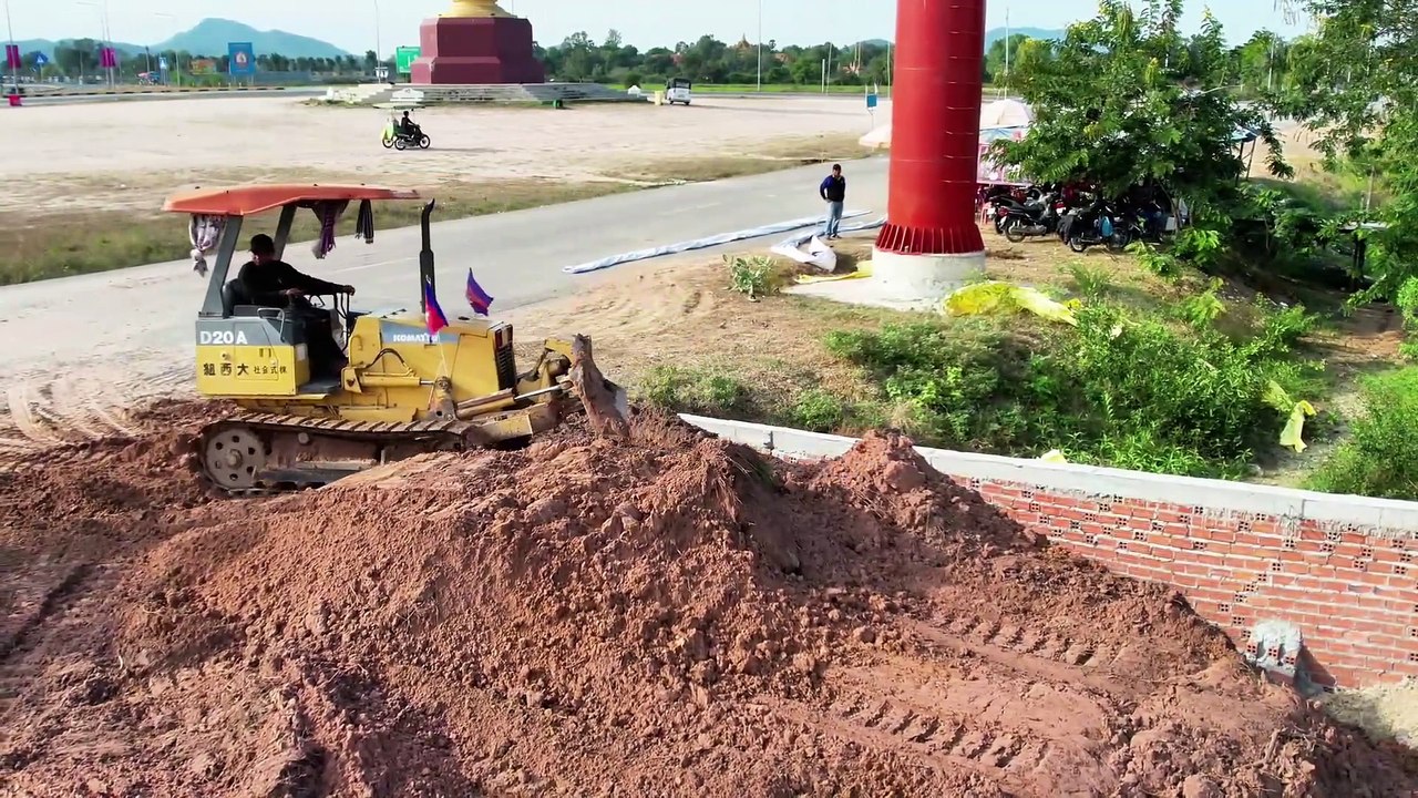 Dropping Soil Bury Drainage System Next to the Road. Drivers Passing by must be very careful.