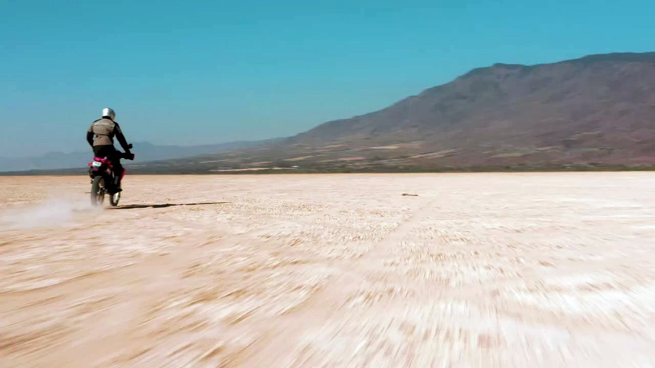 mixkit-tacking-view-of-a-motorcyclist-in-the-desert-43101-hd-ready