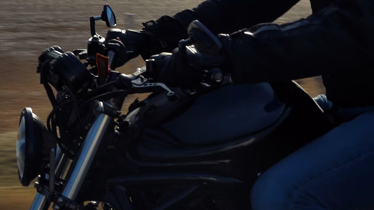 mixkit-riding-a-motorcycle-fast-on-a-sunny-road-39922-hd-ready