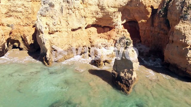 Cliffs and caves of pristine Atlantic Ocean coast, Lagos, Algarve, Portugal