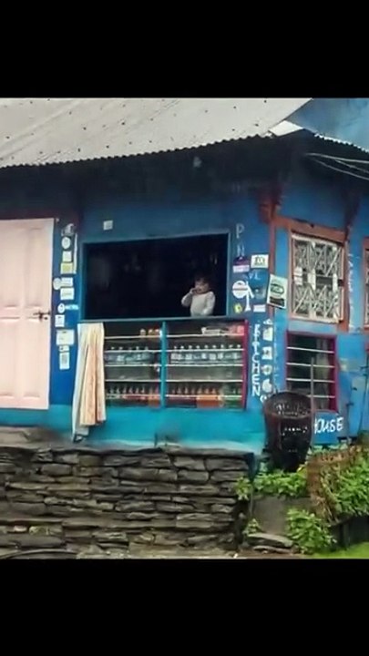 a small child gets happy at the sight of arrival of rain