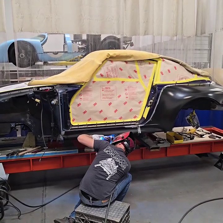 A Porsche 993 Coupe has been secured to the Celette bench for a Twin Turbo