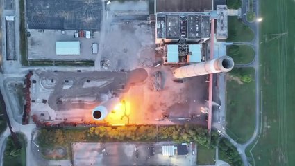 Moment 800-foot-tall power station chimney crumbles to ground in blast
