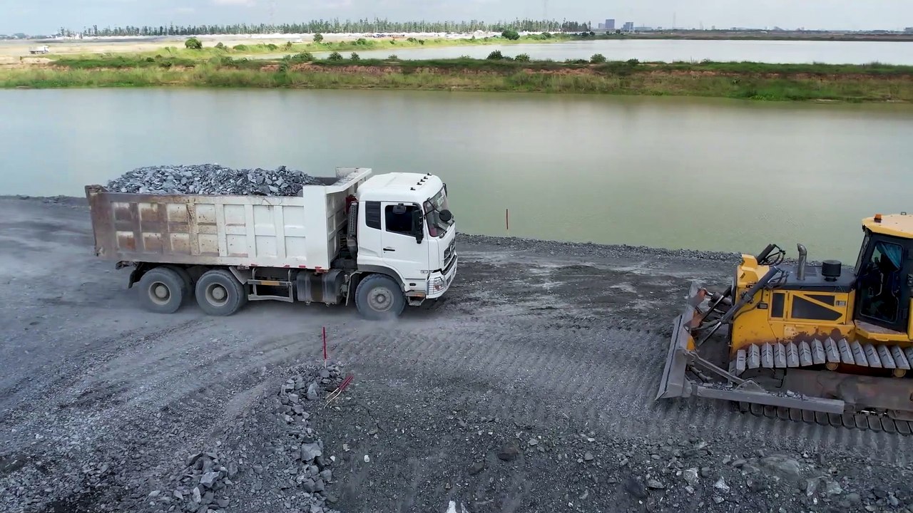Amazing dump trucks Unloading rock With Shantui Dozer working