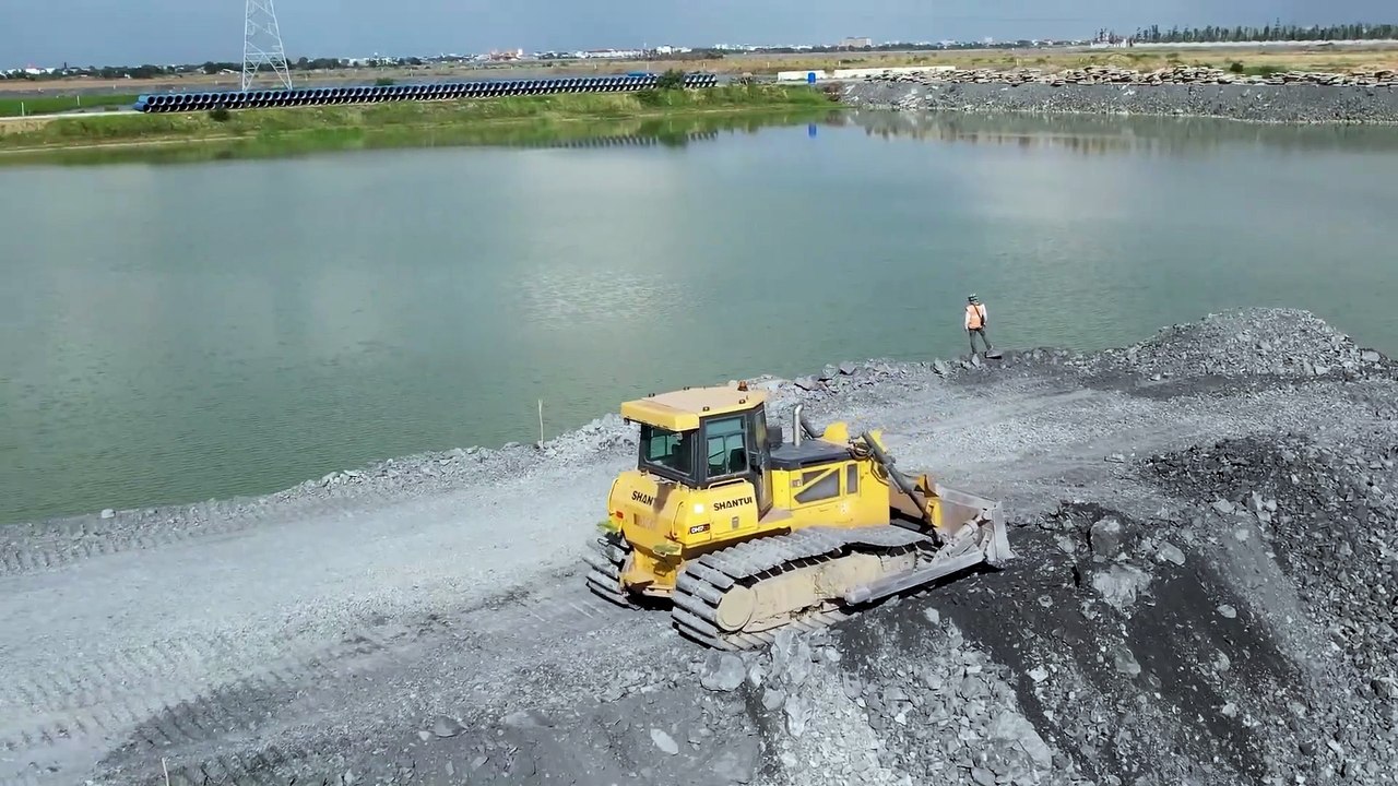 Powerful Dozer and Trucks Are Bringing It Tons Of Compost To Rebuild The Road Foundation