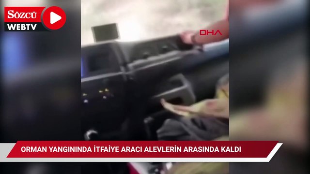 Hatay'daki orman yangınında itfaiye aracı alevlerin arasında kaldı