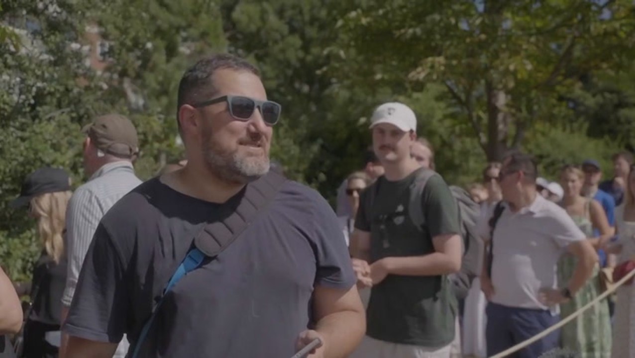 Man sleeps overnight on a dog bed in queue for Wimbledon tickets