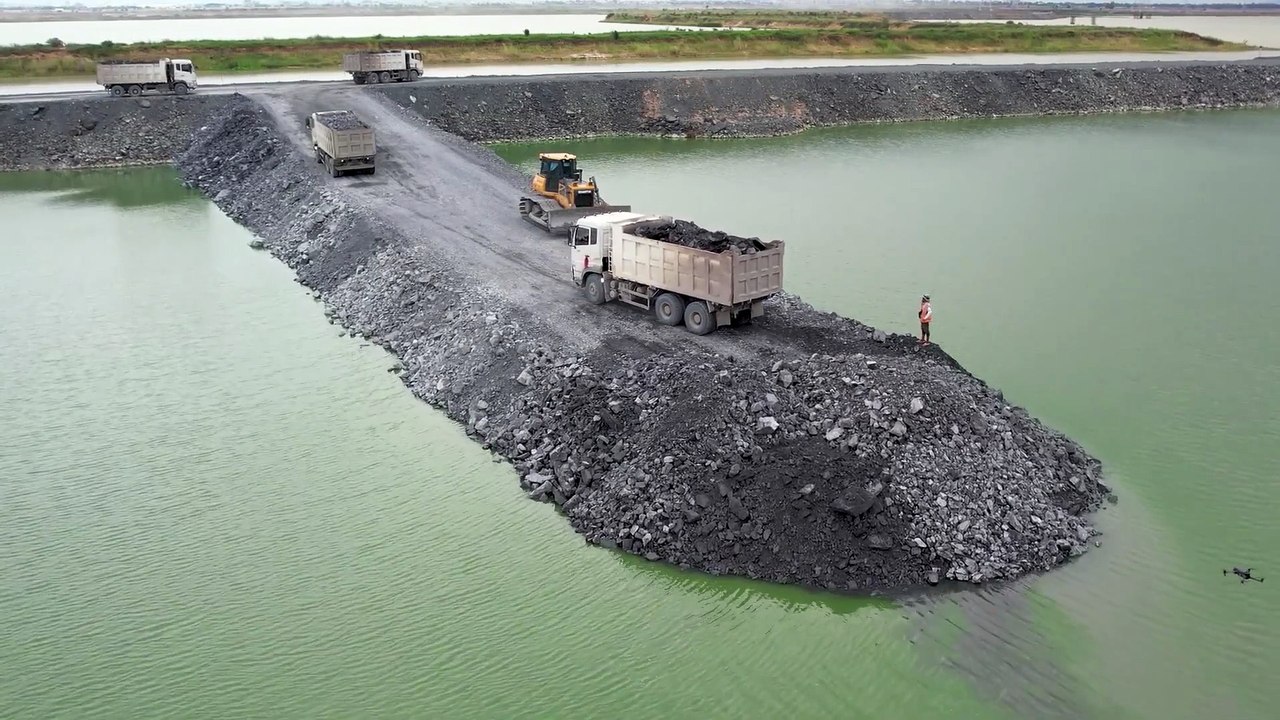 Road Connecting With Heavy Loading Dump trucks and Shantui Dozer Working