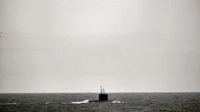 Royal Navy helicopters and warship stalks Russian submarine in British waters