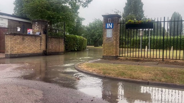 Flooding at Shire Lodge Cemetery in Corby has caused major tailbacks in Rockingham Road this afternoon