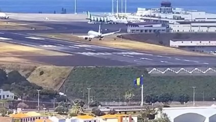 Plane bounces off runway while battling strong winds at popular holiday airport