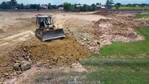 Wonderful Activity Bulldozer D60 Pushing Soil Fill land up with a lot of Dump truck 25 Ton Unloading
