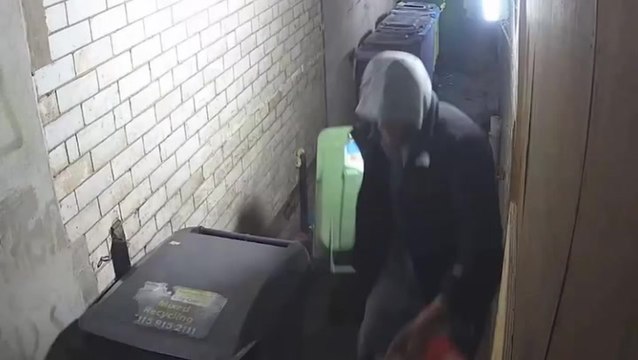 Watch as thieves drag wheelie bin filled with thousands of pounds worth of clothing through city centre