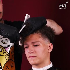 That long curly hair is gone