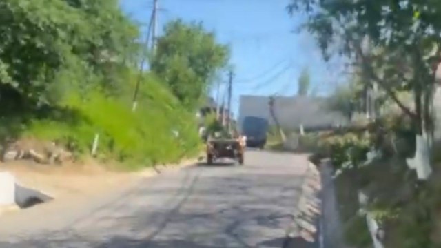 Young man loses balance and falls out of a stripped-down car