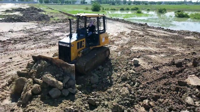 wow !! Excellent Bulldozer CAT Pushing Soil to Water making Road with Truck Unloading