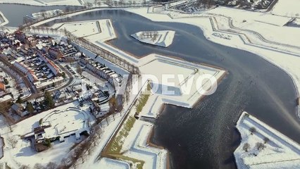 Aerial drone shot of the snowy landscape in the winter