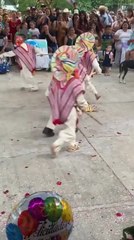 Boy Struggles to Keep Pants Up During Traditional Dance