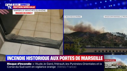 Cette Marseillaise prépare son logement pour la nuit avec des torchons humides à cause de l'incendie qui frappe Marseille