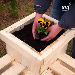 Construct wooden planter benches from pallets