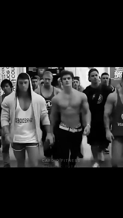 Gymnastics bodybuilders posing in public to impress cute girls.