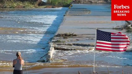 Residents Of Ingram, Texas, Inspect The Edges Of The Guadalupe River Following Deadly Flooding