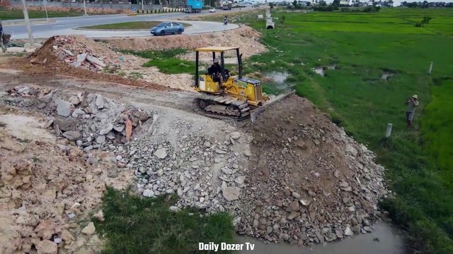 Amazing action Bulldozer Pushing Soil Building New Road with a lot of Dump truck unloading Soil