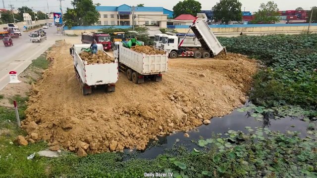 Amazing Activity Dump truck Unloading Soil Stone into Water, Bulldozer SHANTUI Pushing Soil Stone