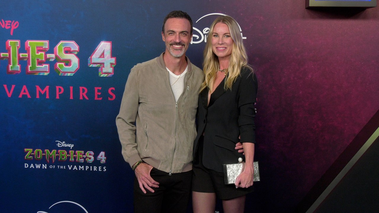 Reid Scott and Elspeth Keller "Zombies 4: Dawn of the Vampires" Premiere Blue Carpet