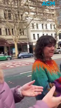 Hill of Content bookstore moves store book by book in human chain across Melbourne street