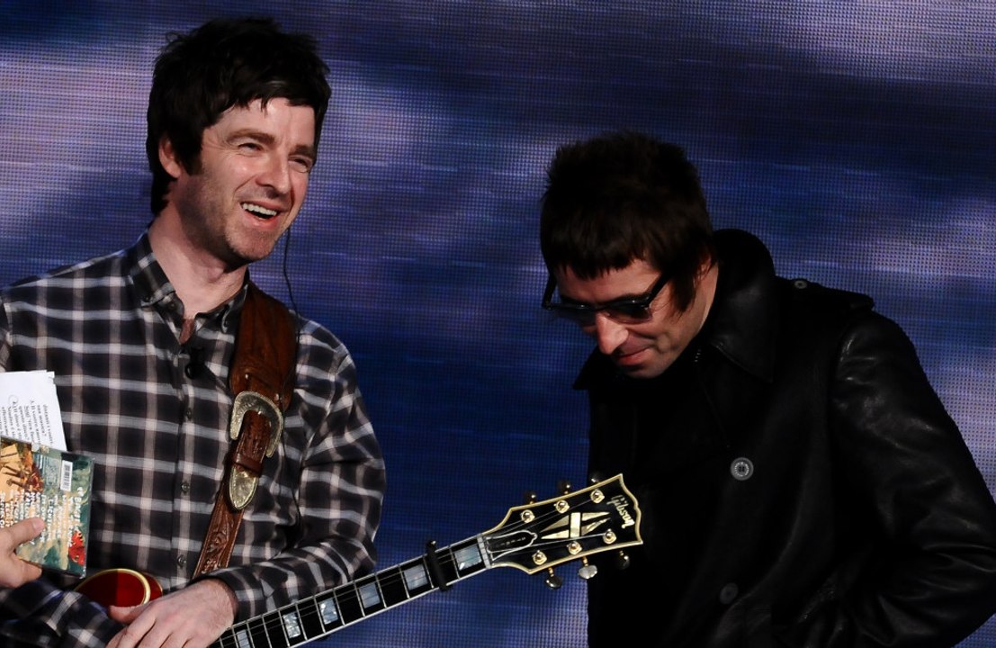 Oasis: Liam and Noel Gallagher use paper straws to warm up their vocals