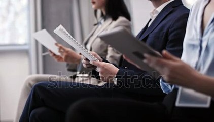 stock-footage-group-of-multi-ethnic-business-people-holding-papers-and-digital-tablets-attending-seminar-or
