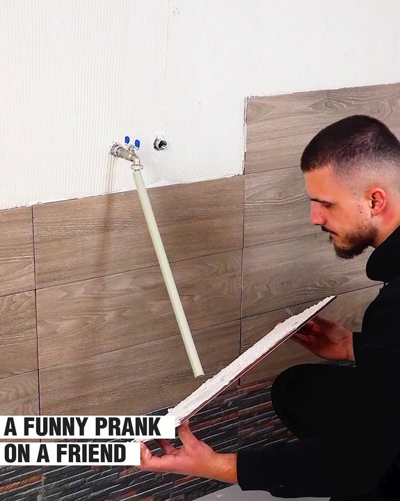 A hilarious video of two friends laying tiles together!