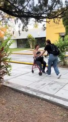Woman Tries to Push Her Friend in Cart but Trips and Falls With It
