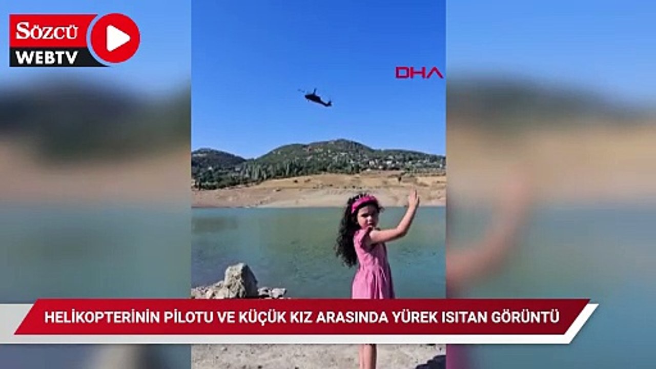 Hatay'da yangın söndürme helikopterinin pilotu ve küçük kız arasında yürek ısıtan görüntü