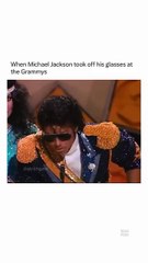 Michael Jackson taking his sun glass